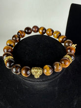 Load image into Gallery viewer, 10mm Brown Tiger’s Eye- Gold Lion and Eye of Horus Bracelet
