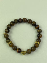 Load image into Gallery viewer, 10mm Brown Tiger’s Eye- Gold Lion and Eye of Horus Bracelet
