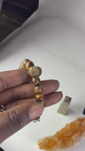 Load and play video in Gallery viewer, 10mm Brown Tiger’s Eye- Gold Lion and Eye of Horus Bracelet
